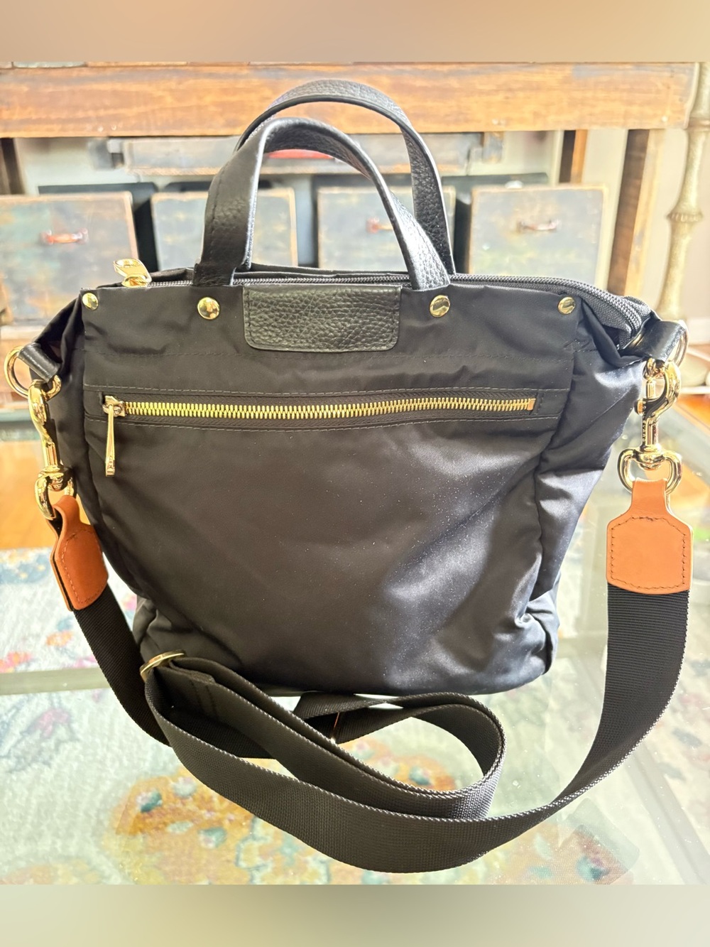 Black Crossbody Nylon Tote with Gold Hardware and Tan Accents